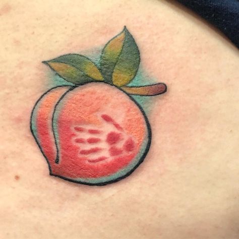 Peach Tattoo | Tattoo Ideas and Inspiration Peach Tattoos For Women, Vulgar Tattoo Ideas, Peach Emoji Tattoo, Peachy Tattoo On But, Thigh Tattoos Color, Peach Tattoo Buttcheek, Traditional Peach Tattoo, Peach Tattoo Design, Swinger Tattoo