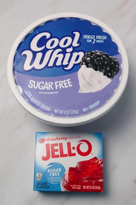 This two ingredient sugar free strawberry fluff is a tasty low calorie dessert! Only 60 calories for a 1/2 cup serving! Strawberry Jello and cool whip combine to make a creamy and comforting dessert. #dessert #lowcaloriedessert #pinkdessert Jello And Cool Whip, Jello With Cool Whip, Sugar Free Deserts, Strawberry Fluff, Cool Whip Desserts, Sugar Free Jello, Sugar Free Recipes Desserts, Sugar Free Pudding, Fluff Desserts