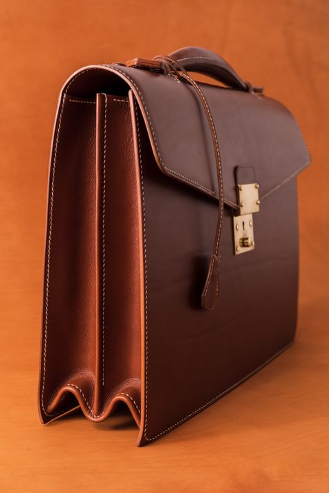 This double gusset briefcase is made from hand selected Tuscan vegetable tanned leather. It features a solid brass lock, stacked leather handle, and is fully lined with luxurious, soft pigskin. All hand stitched, handmade, by Martin Carswell in Melbourne, Australia. #handmade #luxury #madeinmelbourne #craftsman #leathercraft #leather #briefcase #handstitched #carswell #carswellleathergoods #carswellbriefcase #madeinaustralia W Pics, Leather Briefcase Men, Leather Craftsmen, Briefcase For Men, Professional Fashion, Work Bag, Leather Briefcase, Pig Skin, Custom Leather