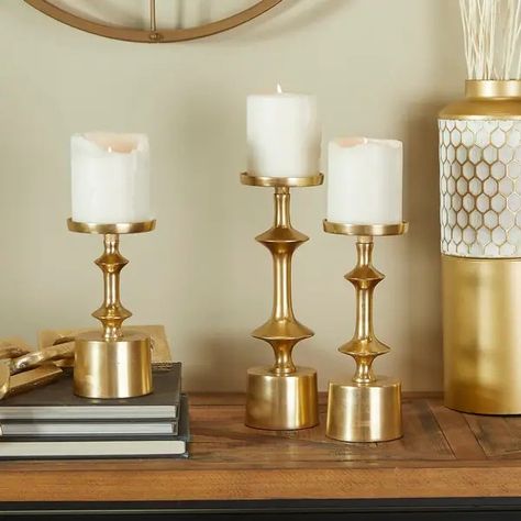 CosmoLiving by Cosmopolitan Gold Aluminum Pillar Candle Holder (Set of 3) - Bed Bath & Beyond - 38297198 Pillar Candle Decor, Decorative Pillars, Round Candle Holder, White Candle Holders, Round Candle, Round Candles, Coloured Candles, Cosmoliving By Cosmopolitan, Pillar Candle Holder