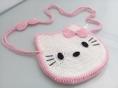 Hello Kitty Bag Crochet, Tooth Fairy Pillow Pattern, Crochet Messenger Bag, Hello Kitty Pillow, Cup Cozy Crochet Pattern, Knitted Purse, Messenger Bag Patterns, Hello Kitty Crochet, Hello Kitty Purse