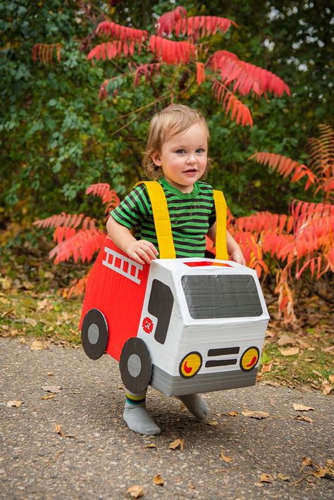 Child standing in cardboard box truck costumes. Cement Truck Costume, Diy Truck Costume, Dump Truck Costume, Monster Truck Halloween Costume, Expensive Halloween Costumes, Cardboard Truck, Cardboard Box Costume, Unique Diy Costumes, Truck Costume