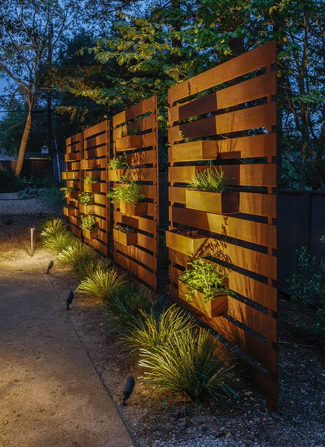 Horizontal Wood Fence With Planters, Tiered Fence Side Yards, Colored Fence Ideas, How To Hide A Generator With Landscaping, Courtyard Privacy Ideas, Indoor Cinder Block Wall Ideas, Free Standing Plant Wall, Privacy Wall With Planter Boxes, Outdoor Accent Wall