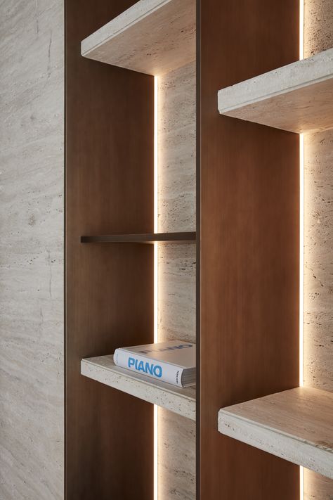 The shelf itself, meticulously crafted from high-quality materials, boasts a flawless, smooth surface that exudes sophistication. 

As you draw nearer, you notice the soft glow of strategically placed lighting that accentuates it. 

Warm, ambient light cascades gently downward, casting a gentle glow. Pins