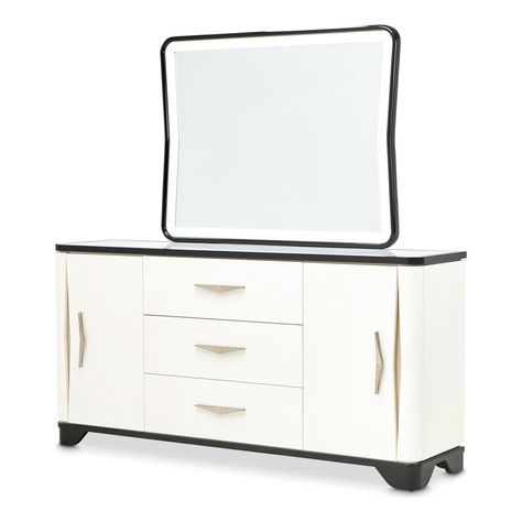 Crowned with a sleek marble inlay, the Tuxedo Sideboard and Mirror Set combines exquisite aesthetics with practical design. The elegant white surface of the sideboard is complemented by spacious cabinets and drawers, including discreet side storage that seamlessly blends with the units sophisticated silhouette. Inside, a silverware tray adds a thoughtful touch, ensuring your finest pieces are stored with the care they deserve. Whether hosting a gala or a quiet family dinner, the Tuxedo Sideboard Sideboard, Sideboard With Mirror, Silverware Tray, Michael Amini, Marble Inlay, Mirror Set, Mirrors Wayfair, Armoire, Drawers