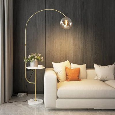 This modern arc floor lamp comes with stylish space-saving storage and flexible lighting benefits all in one. Designed for tight corners or compact living areas, this multi-purpose lighting fixture features a built-in tray table and marble base, which is ample enough for small planters and other items. | Everly Quinn Pamila 70.1" White Tray Table Floor Lamp w / USB Metal / Stone in Brown / Gray / White | 70.1 H x 11.8 D in | Wayfair Standing Lamp Living Room, Modern Arc Floor Lamp, Arc Floor Lamp, Floor Lamp With Shelves, Floor Lamps Living Room, Modern End Tables, Arc Floor Lamps, Compact Living, Room Lamp