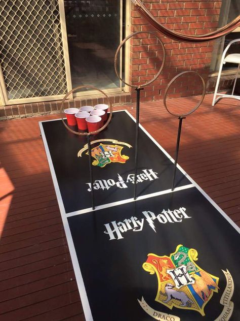 This game is definitely going to be the most liked activity by your guests. The rules remain the same as that of the beer pong. To make the game more Harry Potter-ish, make three rings on three stands as shown below and place them between the two cup-sets and the person should goal by passing the ball through the stands. Harry Potter Beer Pong, Harry Potter Themed Birthday Party, Harry Potter Themed Birthday, Harry Potter Graduation, Harry Potter Themed Party, Harry Potter Christmas Decorations, Harry Potter Theme Birthday, Themed Party Ideas, Harry Potter Props