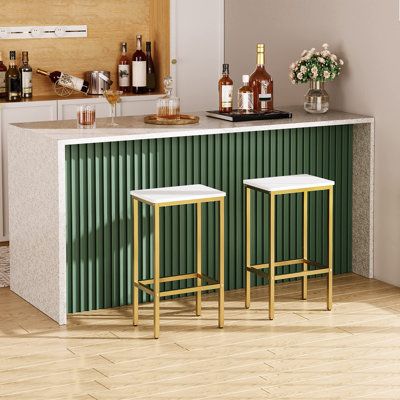 Each golden bar chair is sized at 15"L x 10.6"W x 25.8"H to fit perfectly with all standard bar counters, saving space in your home. They can also be used as the bar stools in restaurants, bars, cafes and terraces.With modern and simple shape and elegant white and noble gold colour matching, each bar stool expresses the light luxury style. No matter which room it is used in, it can add a touch of fashion and enhance the taste of home.Each bar stool is made of high-quality chipboard and thickened Bar Counter Home Design, Under Kitchen Counter Bar Ideas, Modern Breakfast Bar, Cafe Style Kitchen At Home, Diy Bar Counter, High Chair For Kitchen, Counter Bar Kitchen, Breakfast Counter In Kitchen, Kitchen Bar Counter Ideas