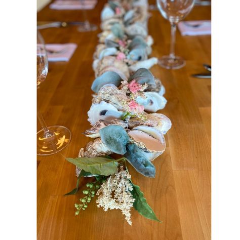 "This Oyster Shell Table Runner  is a lovely grouping of hand picked natural Cape Cod cup shells.    We hand tie each shell to create these dramatic coastal themed Table Runners/Garlands. The display possibilities are endless to dress up a table, mantel , shelf or patio. Which make these a must have for coastal or beach themed events and weddings.   We use a wonderful blend of beautiful oyster shells, each with it's own unique unique size, shape and color.   Each shell is securely hand tied with Nautical Wedding, Oyster Shell Table Runner, Shell Table, Shell Garland, Sailor Bracelet, Wedding Coastal, Coastal Table, Oyster Shells, Oyster Shell