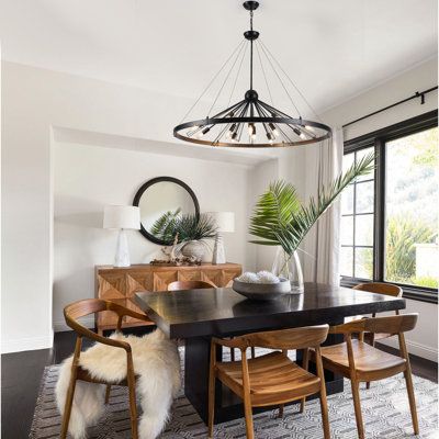 This sputnik wagon wheel chandelier with openwork aesthetic angles can therefore skillfully pair with your space, suitable for kitchen island, dining rooms, living room, bedrooms, breakfast, porch, hallways, office, entryways, foyer, staircase, farmhouse, dining table, entrance, kitchen table, bars, entry, cafes, hotels, and restaurants etc. Finish: Matte Black | George Oliver Kinzah 12 - Light Dimmable Wagon Wheel Chandelier in Black | 31.5 H x 43.31 W x 43.31 D in | Wayfair Staircase Farmhouse, Dining Table Light Fixture, Dark Blue Dining Room, Wagon Wheel Light, Dining Lights, Lights Over Dining Table, Black And White Dining Room, Black Round Dining Table, Entrance Kitchen