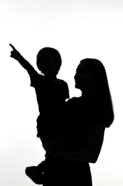 Classic portrait silhouette of mom and c... | Premium Photo #Freepik #photo #child-silhouette #profile-silhouette #mom-child #mom Mom And Son Silhouette, Silhouette Fotografie, Mom Silhouette, Child Silhouette, Portrait Silhouette, Photo Classic, Mom And Child, Classic Portrait, Mother Son Photography