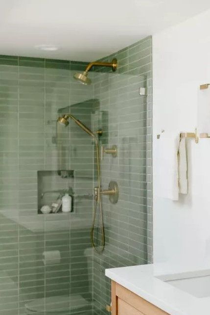 Behold another essay on why green should most definitely be part of your minimalist bathroom. Muted shades of green act like neutrals and pair beautifully with the rest of the quiet colors and textures in your Scandinavian-style space. #scandinavianhomedecor #minimalistbathroomideas #mydomaine #hyggehomedecor #cozybathroomideas #scandinavianbathroomideas Clean Bathroom Inspiration, Bathroom Ideas Neutral Colors Modern, Green Floor Bathroom Ideas, Green Tones Bathroom, Muted Bathroom Colors, Pale Green Bathroom Tiles, Organic Minimalist Bathroom, Scandinavian Interior Bathroom Small, Heath Ceramics Bathroom