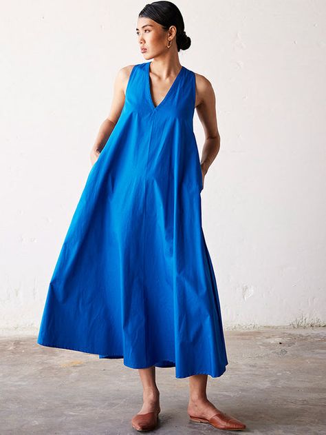 Creating stunning and elaborate ethical silhouettes that go beyond trends. Cotton Kaftan Dress, Dress With Pleats, Blue Maxi Dress, Cotton Kaftan, Timeless Dress, Blue Maxi, Poplin Dress, Cotton Maxi, Made Clothing