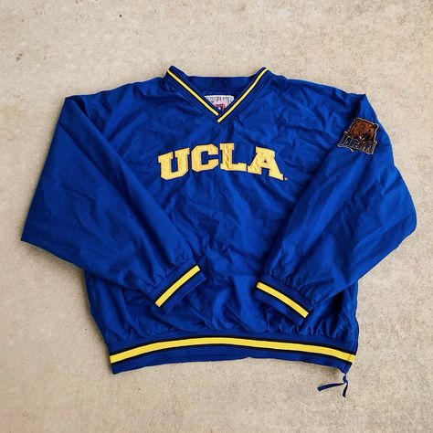 Vintage 1990’s UCLA Bruins Blue Pullover Windbreaker Jacket Ucla Game Day Outfit, Ucla Clothes, Maximalist Bathroom, Modern Vintage Style, Vintage Style Clothing, Football Game Outfit, Strep Throat, Sporty Looks, Men's Windbreaker