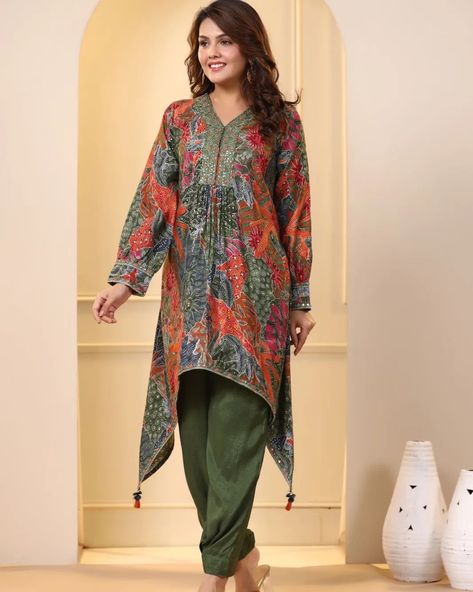 ₹1595 😍 *_D'Wear(Design Your Style)_* Launching *Beautiful and Trendy Co ord set with Updown patterned Tunic beautified with Embroidery work om Yoke and Sleeves,puffed pattern on cuff portion,tussels* *on corners,paired with Silk pant with slight Afghani look* 😍 *Fabric-Muslin kurti with Silk Pant* 😍 *Size-38,40,42,44* 😍 *Price-1595/- free ship* *₹50 less for active reseller only* 🛩️ *READY TO DISPATCH* 🔖 *_Accept with D'Wear Tags only_* #dpc ____________________________... Ladies Dress Design Pakistani, Kameez Designs Pakistani, Pakistani Dress Design Ideas, Lawn Dresses Designs, Ladies Frock Design, Long Frock Designs, Simple Frock Design, Maxi Dress Designs, Kameez Designs