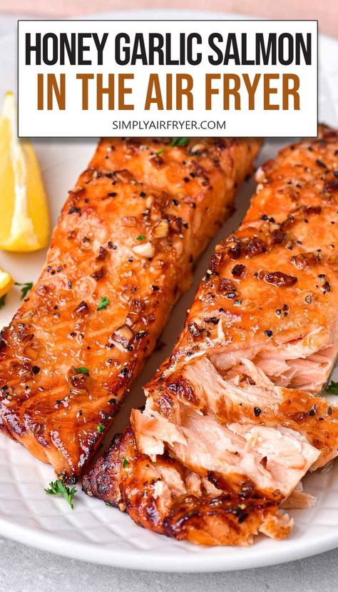 cooked honey garlic salmon fillets on white plate with text overlay "honey garlic salmon in the air fryer". Easter Entrees, Salmon In The Air Fryer, Air Fryer Recipes Salmon, Salmon Recipes Baked Healthy, Honey Garlic Salmon, Garlic Salmon, Air Fryer Oven Recipes, Air Fyer Recipes, Air Fry Recipes