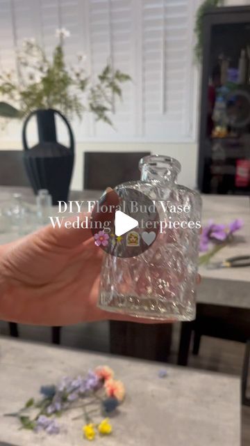 DIY With Jenna 🤍 on Instagram: "Floral bud vase centerpieces DIY ✨🌸🫶🏼

The most GORGEOUS way to include a splash of color without breaking the bank.

Pro tip: check out Facebook marketplace before buying bud vases! I’ve been seeing a ton of brides resell theirs there!

#diywedding #weddingcenterpieces #floralbudvase #budvasecenterpieces #diybride #summerbride #springbride #diyweddingdecor #diyweddingflowers #diywithjenna #weddingflowers #weddingflowerideas" How To Arrange Bud Vases, Stained Glass Vases Diy, Mini Bud Vases Centerpieces, Wedding Centerpieces With Bud Vases, Bud Vase Wedding Centerpieces, Bud Flower Arrangement, Black Bud Vases Wedding, Eucalyptus Bud Vase, Wedding Centerpieces Bud Vases