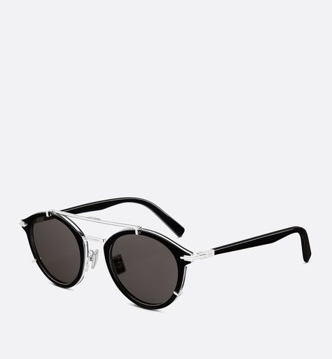 The DiorBlackSuit R7U sunglasses, crafted in bio-acetate, enhance the collection with a sophisticated pantos form. The black frame reveals a signature hinge inspired by the stitched details of Dior Men suits, as well as an engraved CD logo. Thin struts and a subtle border in silver-finish metal complement the gray lenses, while the double bridge lends a touch of modern elegance.. Denim Swimsuit, Dior Star, Dior Men, Icon Shoes, Ballerina Pumps, Dior Book Tote, Christian Dior Couture, Backpack Tote Bag, Dior Sunglasses