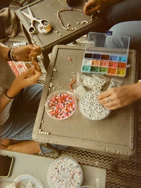 Bead Making Aesthetic, Friends Making Bracelets Aesthetic, Making Jewellery Aesthetic, Friendship Bracelets Making Aesthetic, Making Bracelet Aesthetic, Art And Crafts Aesthetic, Making Beaded Jewelry Aesthetic, Aesthetic Bracelet Making, Making Bracelets With Beads Aesthetic