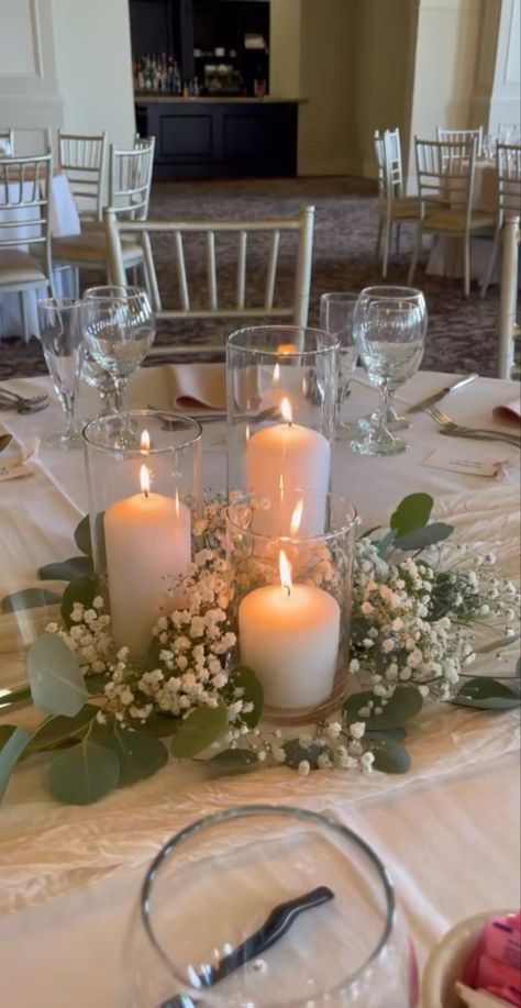 Candle In Vase Centerpiece, Rustic Gold Wedding Decor, Elegant Modern Wedding Centerpieces, Water Centerpieces With Lights, Centerpieces For Gala Events, Chandelier Decor Wedding, Flameless Candle Centerpieces, White Table Wedding Decor, Wedding Centerpieces Minimalist