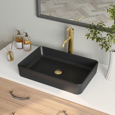 Being made from high-quality ceramic with a seamless and sleek design makes the modern white countertop ceramic rectangular bathroom vessel sink extremely durable. Its surface is scratch and stain-resistant and is easy to maintain with regular cleaning. With a rectangular design and glossy surface, this vessel sinks easily and updates any traditional, transitional, or contemporary bathroom. Sink Finish: Matte Black | DeerValley Ally 20" Ceramic Rectangular Vessel Bathroom Sink in Black, Size 4.3 Black Sink Bathroom, Black Bathroom Sink, White Vessel Sink, Rectangular Vessel Sink, Vessel Sink Vanity, White Countertop, Unique Bathroom Vanity, Rectangular Bathroom, Black Sink