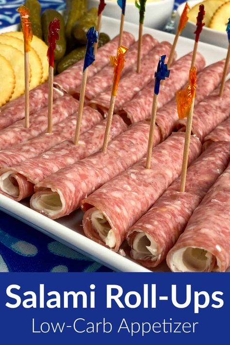 Cream cheese spread on salami and rolled up makes one of the best low-carb and keto snack recipes we’ve eaten! Perfect for grazing at a family holiday meal or enjoying at a party these snacks can be made ahead of time and are easy to transport over a long distance. There's something fun about finger food with a frilly toothpick that can be eaten in just a few bites. Spreading cream cheese inside each slice of salami helps it stick together as it is rolled or folded. Charcuterie Roll Ups, Easy Transportable Appetizers, Card Party Snacks Appetizers, Easy To Transport Appetizers, Finger Foods Cold, Baptism Brunch, Salami Appetizer, Glamping Camper, Salami Rolls