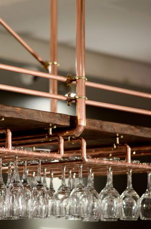 Copper Piping Ideas, Copper Bar Shelves, Copper Restaurant Design, Copper Pipe Ideas, Copper Interior Design, Suspended Bar, Copper Shelves, Copper Shelving, Copper Restaurant