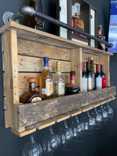 This was made out of pallets and plumbing pipe. Mix of industrial rustic decor for a garage bar or man cave Man Cave Home Bar Garage, Farmhouse Man Cave Ideas, Outdoor Bar Shelf, Bar Man Cave Ideas, Basement Man Cave Ideas Rustic, Diy Bar In Garage, Rustic Man Cave Decor, Garage Makeover Bar, Outdoor Corner Bar Ideas