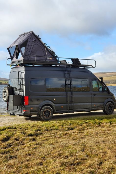 This is van life at its finest: MAN TGE 4x4 campervan, equipped with a bespoke roof rack, TentBox, external storage box, and built-in sun loungers on the roof deck.   This is 'The Lion', a custom van conversion build which sleeps and seats 5. The exterior is hot property, but the interior is as cool as a luxury ski chalet in The Alps.  If you dream of exploring in style and comfort, pin this as your ultimate camper van inspiration! Tv In Campervan, Camper Van Roof Bed, Camper Van Exterior, Campervan Exterior, Ski Lodge Interior, Sprinter Camper Conversion, Van Inspiration, Van Conversion Build, Van Roof Racks