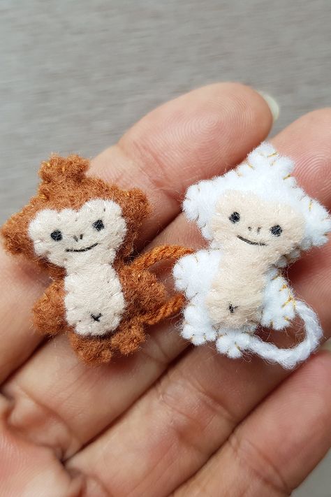 Tiny brown and white monkey stuffed animal smiling. The sweet little face is detailed with embroidery thread and the tail is made of wool yarn. Monkey Diy Crafts, Mini Plush Pattern, Tiny Stuffed Animals Diy Sew, Hand Sewn Plushies, Hand Sewn Stuffed Animals, Monkey Sewing Pattern, Tiny Stuffed Animals, Small Plushies, Monkey Diy