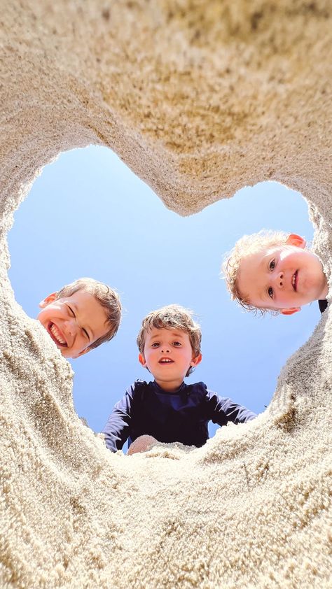 HOW TO TAKE A SAND HEART PHOTO AT THE BEACH | Design Darling Beach Pictures Family Outfits, Sand Heart Photo, Photo At The Beach, Family Beach Pictures Poses, Fun Beach Pictures, Baby Beach Photos, Sand Heart, Family Beach Photos, Beach Vacation Pictures