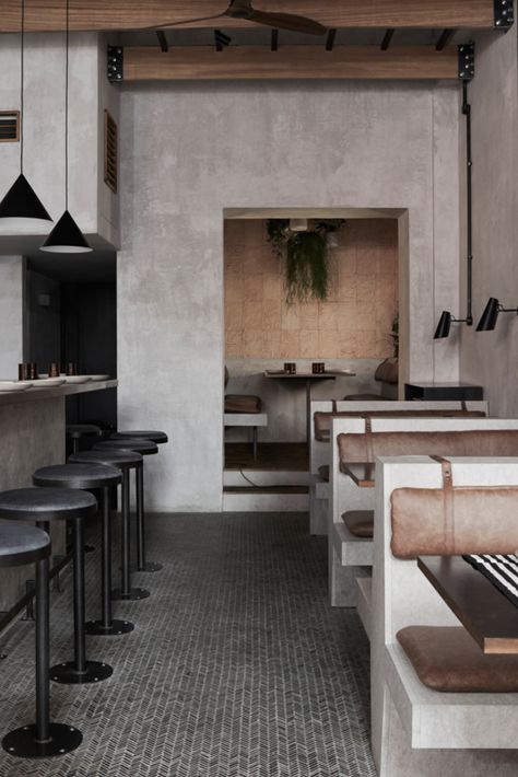After a successful stint as a pop-up, Sri Lankan restaurant Paradise has set up shop in Soho with a tropical brutalist oasis on Rupert Street.

Designer Dan Preston crafted the interiors for the London restaurant, which hone a tropical vibe via exposed timber trusses and raw concrete walls.

#london #travel #interiors #restaurant #design #interiorstyle #concrete #minimalism Sri Lankan Restaurant Design, Concrete Wall Restaurant, Concrete Interior Design Restaurant, Brutalist Cafe Interior, Concrete Restaurant Design, Concrete Bar Design, Minimal Restaurant Design, Minimal Bar Design, Raw Interior Design