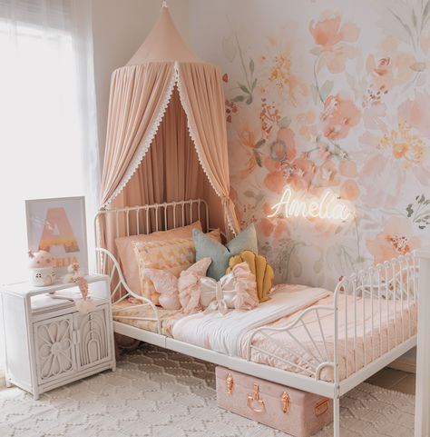 Stephanie from The Vara Tribe on Instagram has done it again with this dreamy pink girl's bedroom. With pink floral wallpaper, a gorgeous pink magnolia botanical garden canopy from Spinkie, butterfly wall decals from Little Custom Creations, LED neon name from Letterly and Mustard shell cushion from Peppermint Tree Creations, it's not hard to see why this pink bedroom is so popular. Click on the pin to see our full interview with Stephanie, and full list of materials to help you get the look! Montessori, Baby Crib Canopy, Girls Bedroom Paint, Girls Room Colors, Big Girl Room, Room Revamp, Pink Bedroom For Girls, Toddler Bedroom Girl