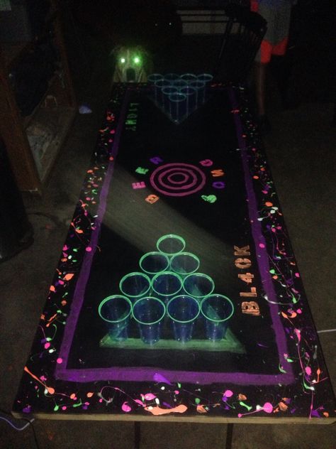 #blacklight #beerpong neon beer pong table glow in the dark beer pong Glow In The Dark Beer Pong Table, Halloween Beer Pong Table, Halloween Beer Pong, Beer Pong Table Designs, Beer Olympics, 21st Birthday Banner, 14th Birthday Party Ideas, Beer Olympic, Beer Table