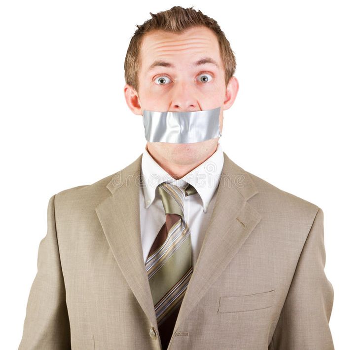 a man with duct tape on his mouth is wearing a suit and tie, looking at the camera