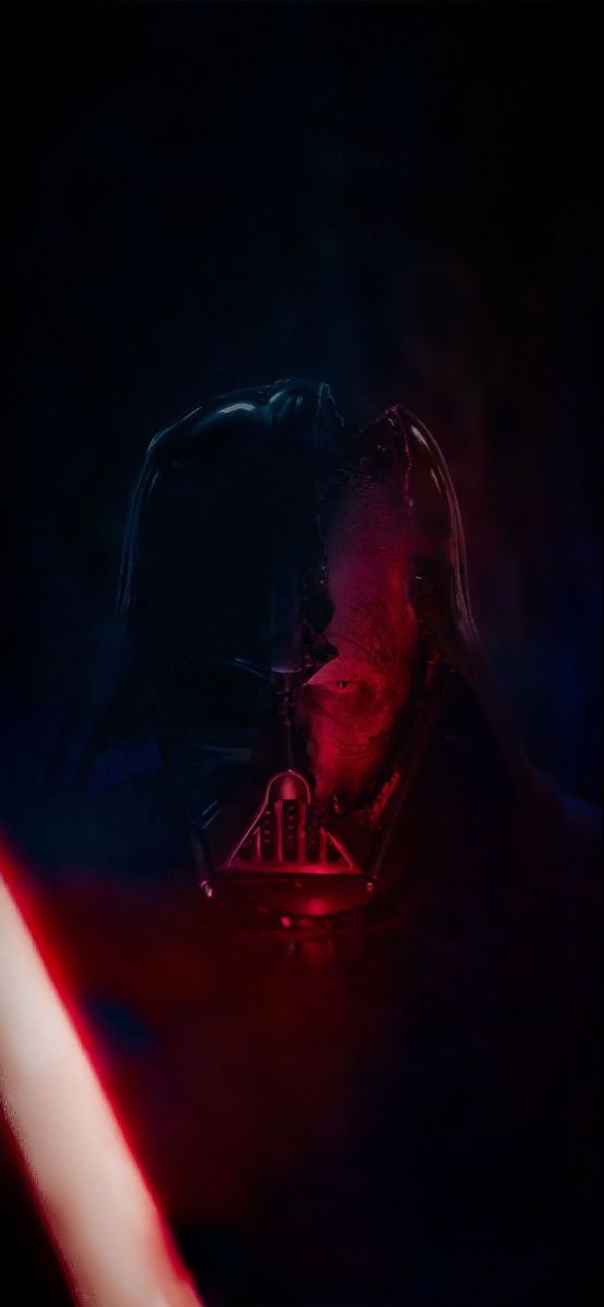 darth vader in the dark with red light coming from his head and lights behind him