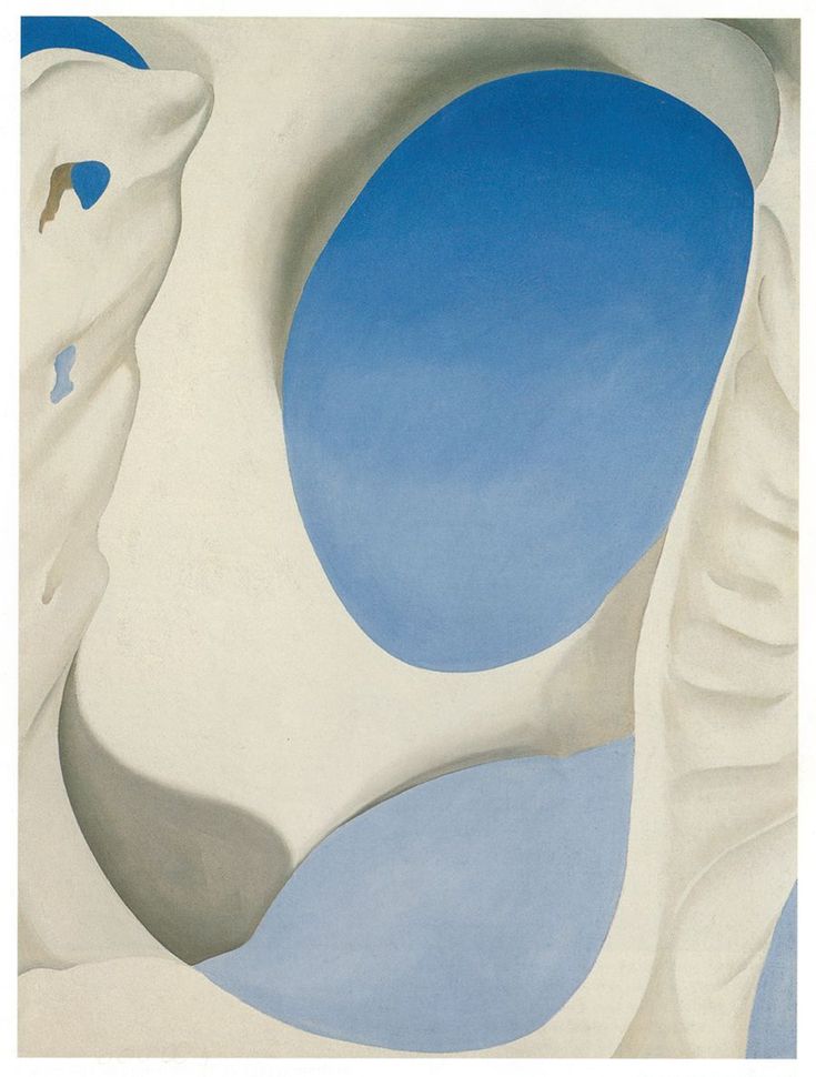 an abstract painting with blue and white shapes in the center, against a light blue sky