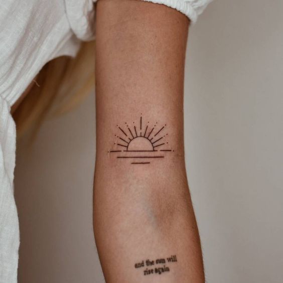 a woman's arm with a tattoo that reads, the sun is not as bright as the sky