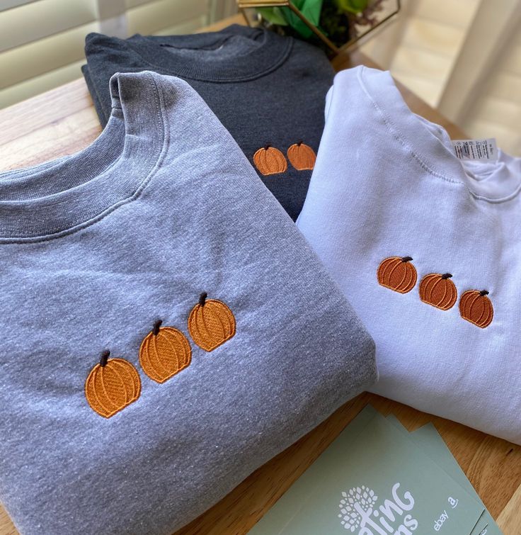 Pumpkin Embroidered Sweatshirt Crewneck is light weight, and perfect for layering! We use 4 UNISEX STYLE Brands: Smart Blank, Gildan, Cotton Heritage, & Hanes  The brand will depend on your size. All crewnecks are true to size.  However, if you enjoy a relaxed and lose fit, please size up.  ✈️ PRODUCTION TIME & SHIPPING:: Production Time: Sweatshirts are made within 3-5 business days from when the order is placed. Shipping Time: Standard Domestic Shipping  (3-5 business days after production tim Spooky Season Crewneck, Iron On Patches Ideas Sweatshirt, Halloween Embroidered Crewneck, Fall Crewneck Sweatshirt Embroidery, Cute Fall Hoodies, Embroidered Fall Sweatshirt, Halloween Embroidered Sweatshirt, Embroidered Halloween Sweatshirt, Cute Fall Sweatshirts