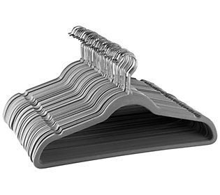 a stack of silver clothes hangers on a white background