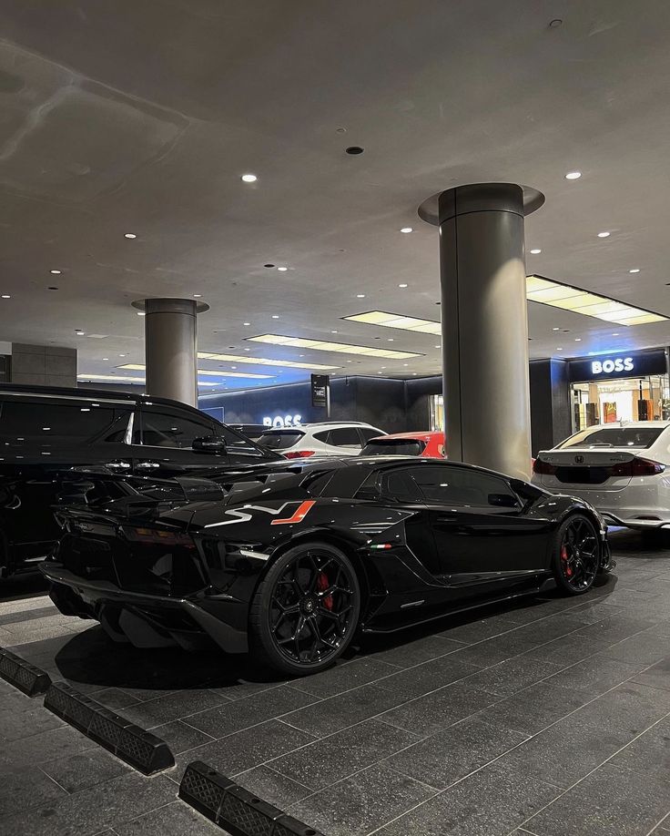 there are many cars parked in the parking garage