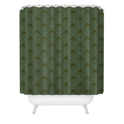 a green shower curtain with an abstract pattern on the front and back of it,