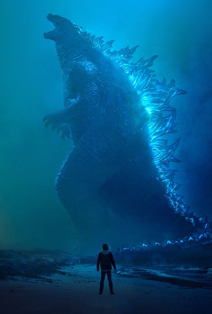 godzilla movie poster with man standing in the foreground and another person looking at it