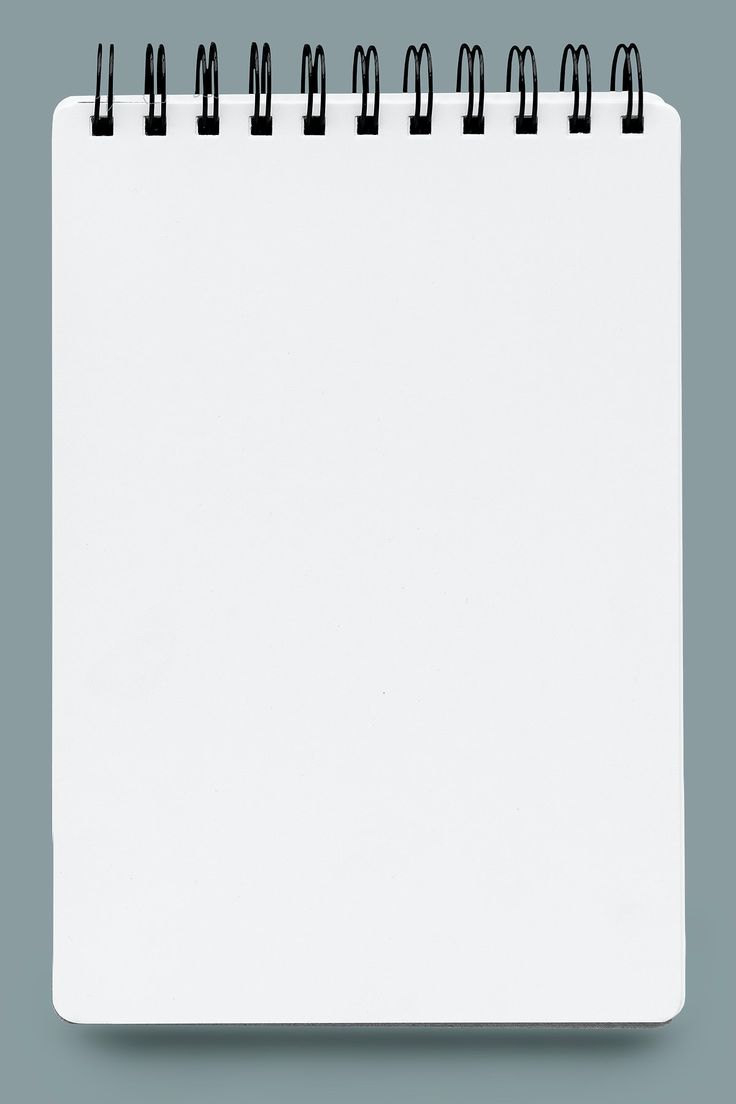 a blank notepad with black marker marks on the front and back cover, in an angled position