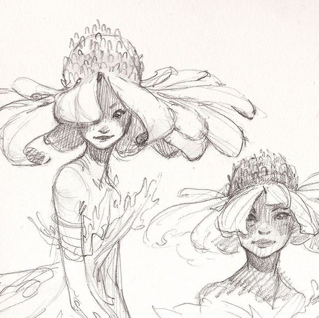 two women with hats on their heads are in the water and one is wearing a flowered headdress