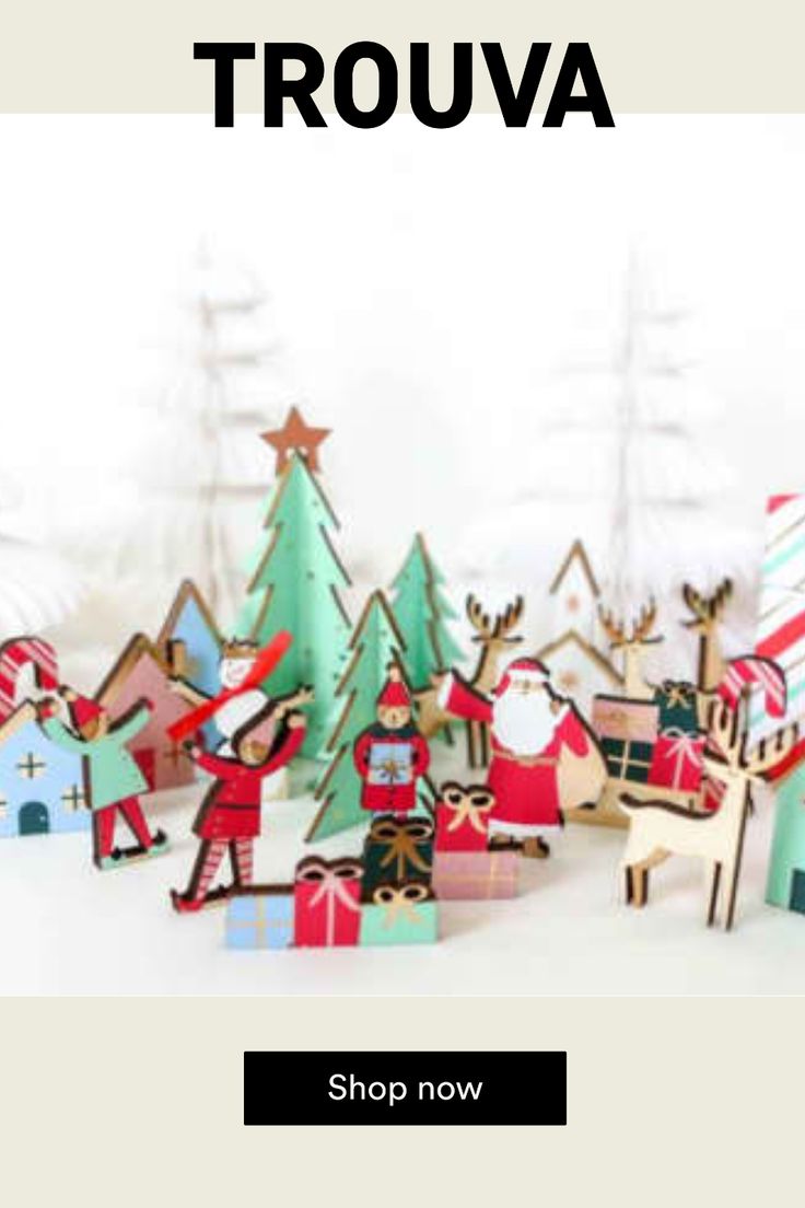 a group of paper cut out christmas trees with santa and reindeers on them in front of a white background