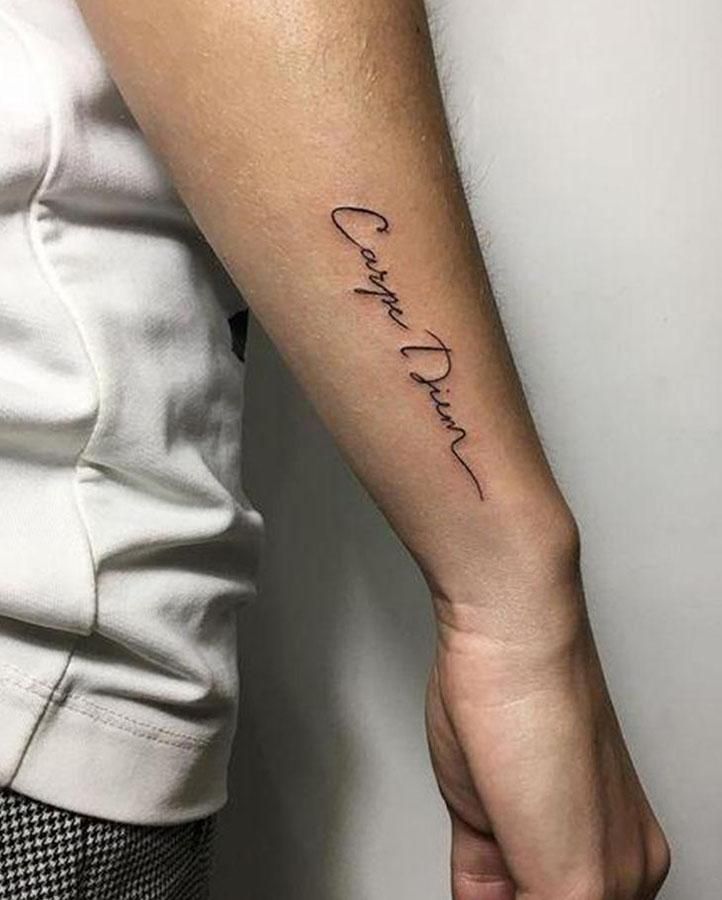 a person with a tattoo on their arm