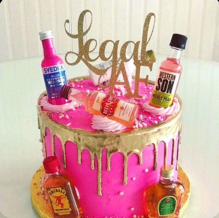 a birthday cake decorated with liquor and condiments