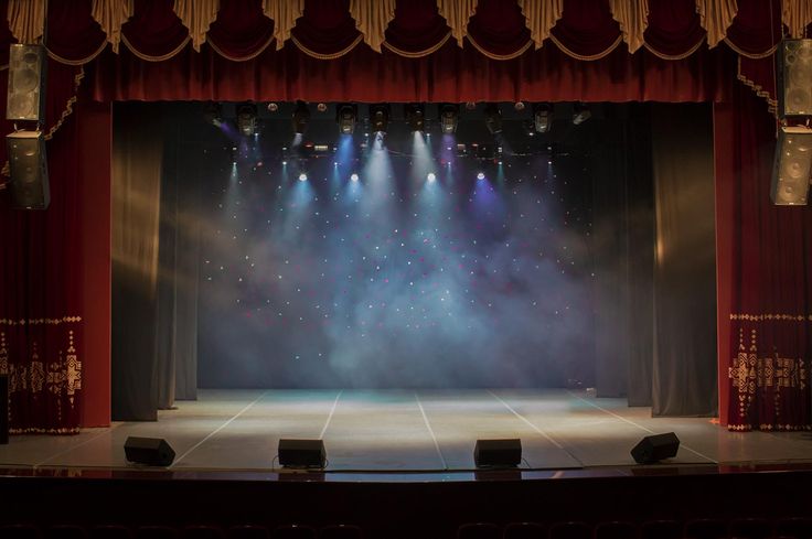 an empty stage with several spotlights on it