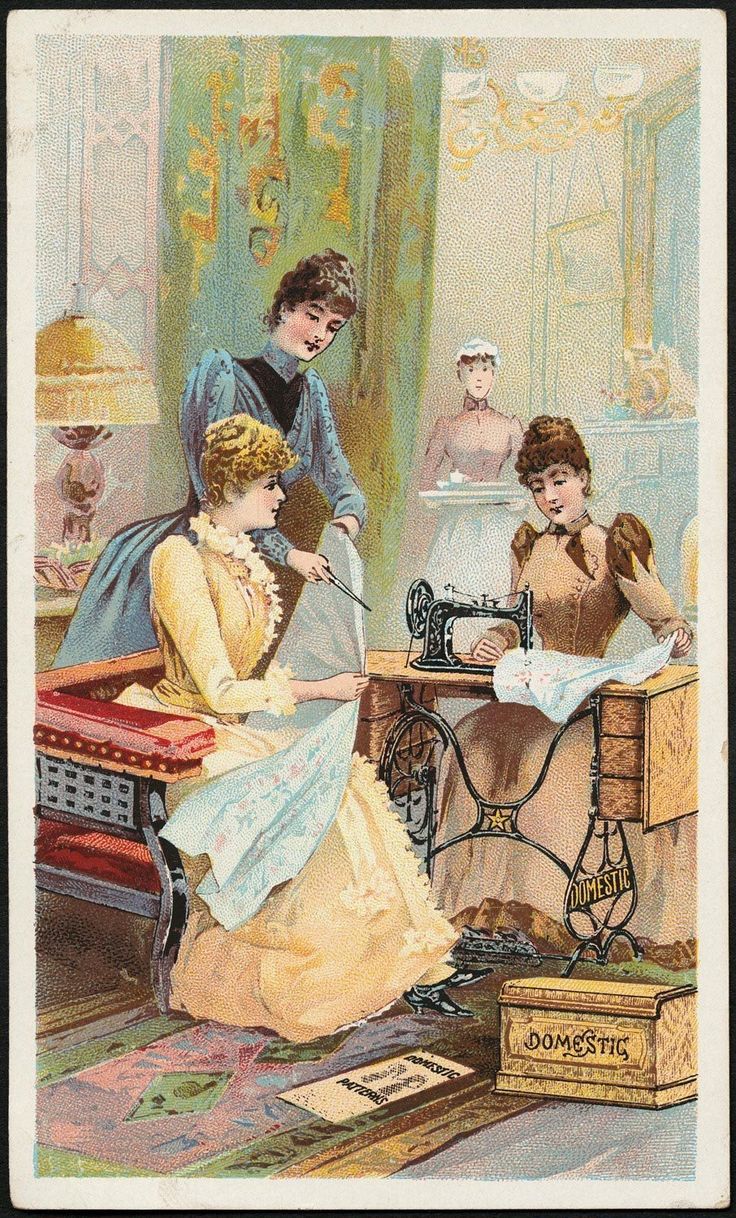two women are sewing on an old fashioned sewing machine while another woman is sitting at the table